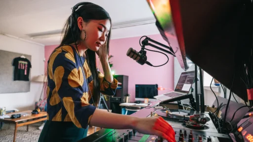 Young Female DJ Making Music in her Home Recording Studio